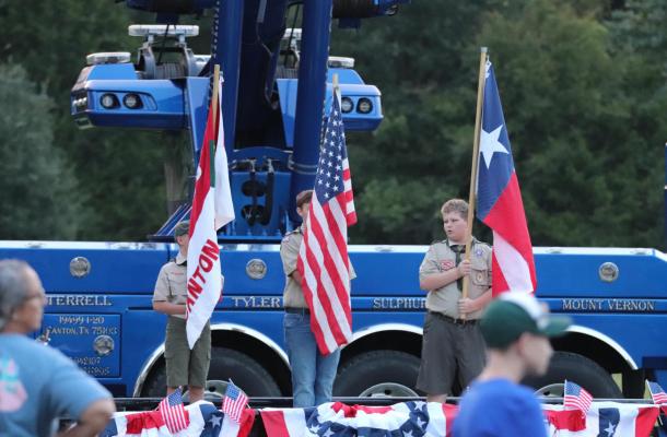 Members of the Boy Scouts helped to present the flags during Saturday’s pre-race ceremony. Photo by Lianna Reid