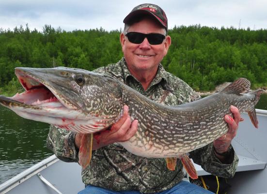 Fishing on a wilderness lake in Canada is something every avid angler should experience at least once. Luke shows off a big northern pike he landed in northern Saskatchewan. Photo by Luke Clayton