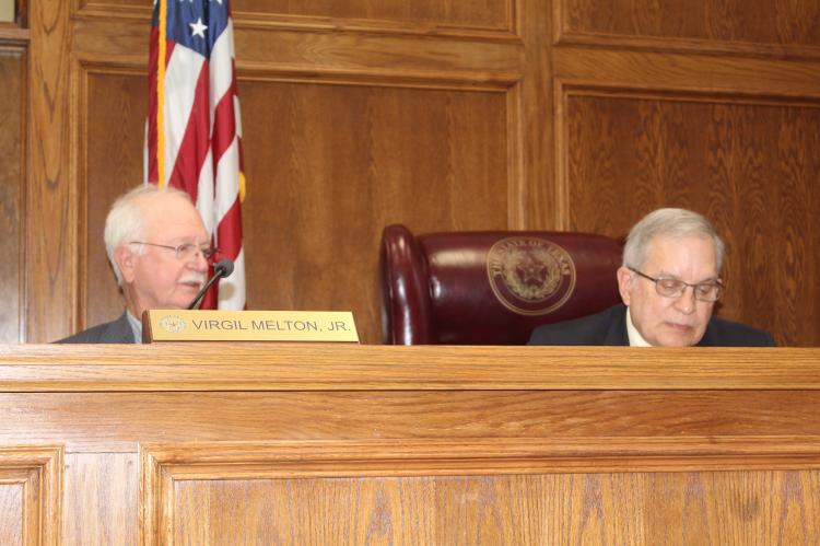 Van Zandt County Pct. 2 Commissioner Virgil Melton Jr., left, responds to a question from VZC Judge Andy Reese during a special called meeting Oct. 23 of the commissioners’ court. Photo by David Barber