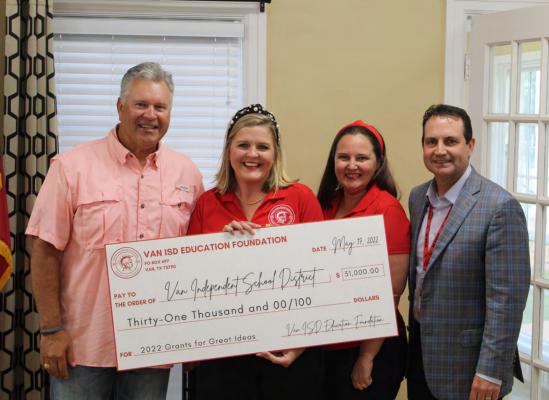 Representatives of the Van ISD Educational Foundation presented Van ISD Superintendent Don Dunn (far right) and Van School Board President Scott Thomas (far left) with a donation check totaling $31,000 for the school district during the regular monthly school board meeting May 16. Photo by David Barber