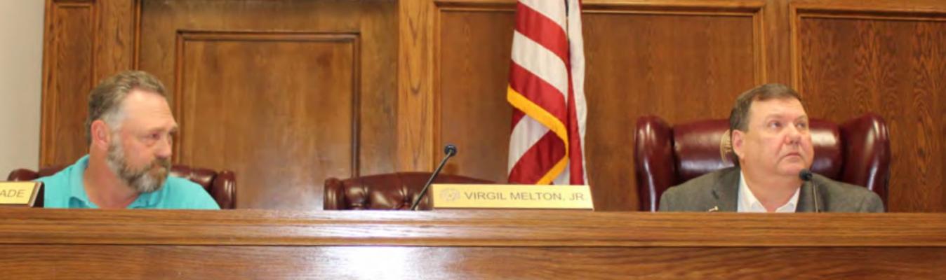 Van Zandt County Pct. 1 Commissioner Chad LaPrade (left) and VZC Judge Don Kirkpatrick listen to a presentation Oct. 27 during the regular meeting of the VZC Commissioners Court. Photo by David Barber