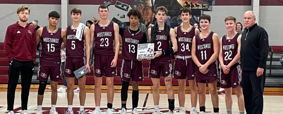 The Martins Mill Mustangs recorded wins over Class 4A Mabank, Class 3A Malakoff and Class 3A Edgewood to top the field at the annual Bryan Mewbourn Varsity Basketball Tournament Dec. 16-18. Photo courtesy of the Martins Mill Athletic Booster Club FB page