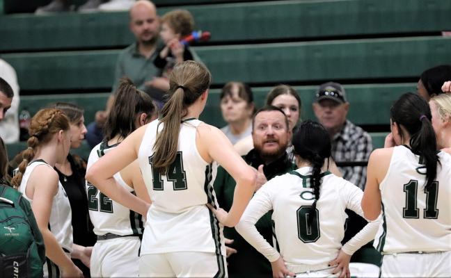 Head Coach Troy Carrell talks to his team during a timeout in Canton’s one-point victory over Mabank on Friday night. Photo by Lianna Reid