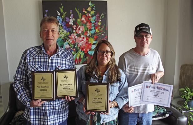 Van Zandt Newspapers L.L.C. recently received a number of awards at the 99th Annual North and East Texas Press Association (NETPA) Convention in Pilot Point. Shown with the awards were left to right, Van Zandt Newspapers L.L.C. staff members Tim Ball, Graphic Designer; Amanda Greene, Office Manager/Layout; and Brian Edwards, Operations Manager. Van Zandt Newspapers L.L.C. publishes the Van Zandt News, Canton Herald, The Terrell Tribune, and The Kaufman Herald. Photo by David Barber