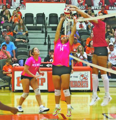 Giana McConico's (#14) set is blocked by Jordan Flodder in Kemp’s home district match versus Van on October 2nd. Photo by Blaine Clamon