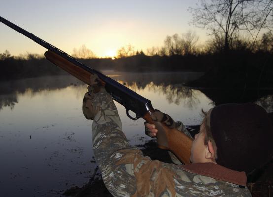 Hunting ducks is a great way to introduce youngsters to the outdoor lifestyle. Safety first, always! The youngster can set in front in the blind where he can best be instructed. Photo by Luke Clayton