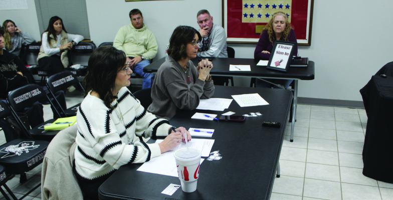Martins Mill Junior High School and Martins Mill High School Principal Robin Gandy (foreground) and Martins Mill Elementary School Principal Carrie Jenkins presented their monthly reports during the regular monthly meeting of the Martins Mill School Board Jan. 12. Photo by David Barber