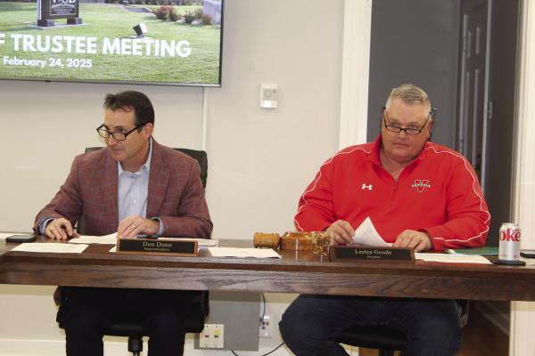 Van ISD Superintendent Don Dunn (left) listens to a question from a school board member Feb. 24 during the regular monthly meeting of the Van School Board. Also listening was Van School Board President Lesley Goode. Photo by David Barber