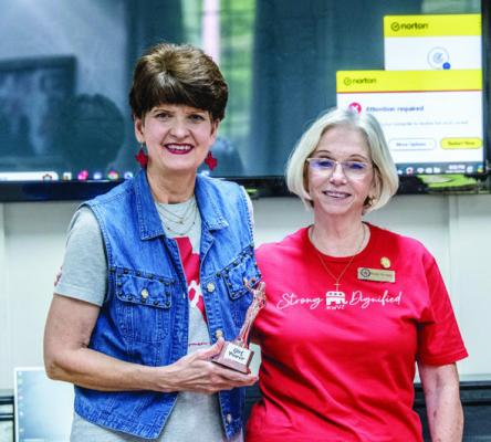 Debbie Burden (left) was honored with the ‘Girl Power’ award for the first quarter of 2024 by the Republican Women of Van Zandt during a recent meeting. Presenting the award is Rocky Norman of the Republican Women of VZ. Courtesy photo