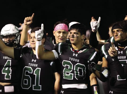 Following an emotional ‘Senior Night’victory over the Brownsboro Bears Oct. 20, the Canton Eagles listened to the playing of the school song. Among those standing at attention were Logan Faglie (4), Mike Vasquez (61), Collin Campuzano (20), and Noe Mendieta (7). The Eagles enjoyed an open date before traveling to Rusk for their final regular season game Nov. 3. Photo by Lianna Reid