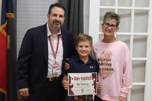Van Middle School fifth grade student Bo Penny received a ‘Vantastic’ award Nov. 13 from the Van School Board during its regular monthly meeting. Bo was recognized for his recent act of bravery in getting help for his teacher, Heidi Moore (right), who had a medical emergency in her classroom. Presenting the award is Van ISD Superintendent Don Dunn. Photos by David Barber