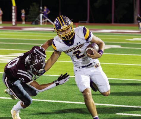 Edgewood Bulldog quarterback/running back Brady Bannister (2) fights for yardage against a Troup Tiger defender Oct. 6. The Bulldogs lost to undefeated Troup, 45-21, and hosted Quitman for Homecoming Oct. 13. Edgewood will enjoy an open date Oct. 20. Photo by Dusty Goodwin