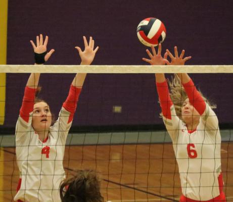 Ashlyn Lloyd (4) and Maci Jones (6) went sky high above the net to slow a Blue Ridge kill attempt Aug. 28. Van would go on to win the match in three sets. Photo by David Kapitan