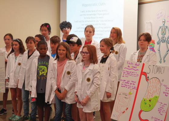 TJC’s Pre-Med Academy summer camp students participated in a white coat ceremony, complete with kid-sized jackets and reciting an adapted version of the Hippocratic Oath. Photos courtesy of TJC