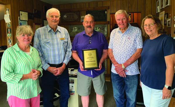 Henry Hallman of Hallman Memorials (middle) received an appreciation plaque July 8 from members of the Van Zandt County Historical Commission. Presenting the appreciation plaque were VZC Historical Commission members (left to right) Suzie Bass, Elvis Allen, Tim West, and Sherrie Archer. Courtesy photo