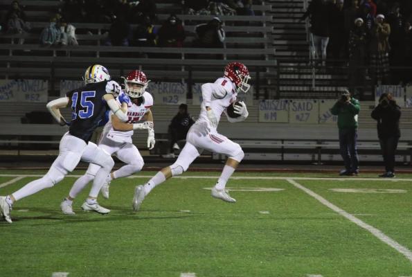 Ryder Shoquist (8) races ahead of the Sunnyvale defense for a 65-yard touchdown reception during Area round play last week in Rockwall. Photo by Liz Meyers/Van HS Journalism Dept.