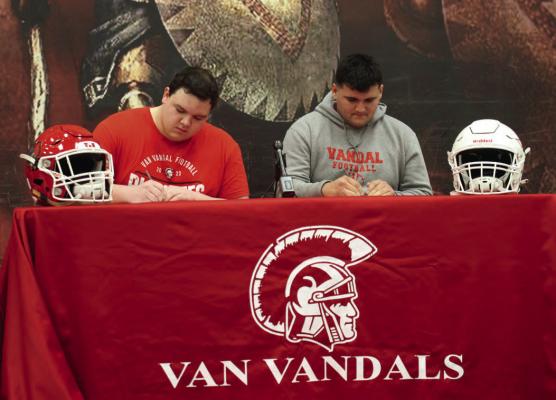 Van Vandal offensive linemen Ace Bostick and Jose Suarez signed National Letters of Intent to play college football at Blinn Junior College. The signing ceremony was held Feb. 7 at the Van High School Cafetorium. Photo courtesy of the Van High School Journalism Department