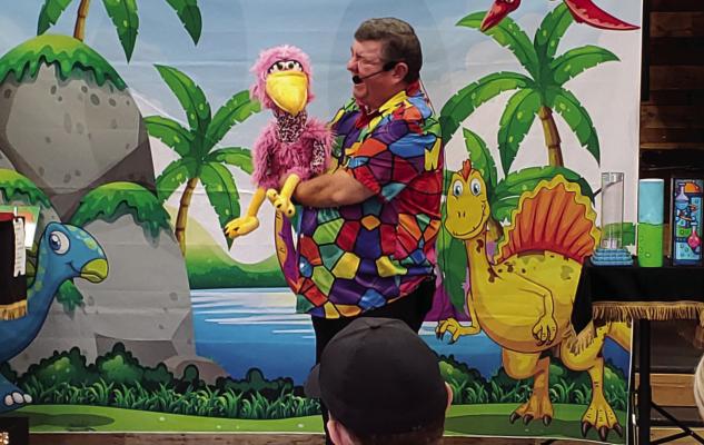 Local entertainer Mike Corry, from Grand Saline, brought his dinosaur-themed magic show to Sharon’s Place. More than two dozen adults with special needs had a great time watching him perform and participating as well. Courtesy photo