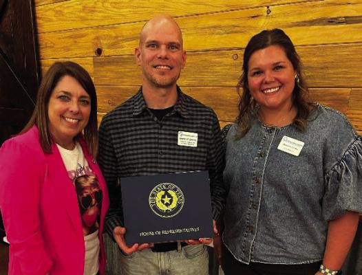The East Texas Crisis Center recently received an honorary Texas Flag from Texas District 2 State Representative Jill Dutton. Shown were left to right, Dutton; East Texas Crisis Center Director of Marketing and Public Relations Jeremy Flowers; and Case ManagerAshlyn Lewis. Courtesy photo