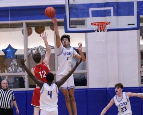 Above, Kody Alexander turned back what could have been a potential game-winner by Van on Tuesday night, helping Wills Point secure a 42-39 win in the process. Right, Marc Battle and the Wills Point Tigers finished the regular season with a 3-1 record against their two biggest rivals, Canton and Van. Photos courtesy of WPHS Yearbook staff