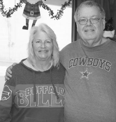 Prior to kickoff Dec. 17 between the Dallas Cowboys and the Buffalo Bills, two Van Zandt Newspapers L.L.C. employees, Senior Reporter David Barber and Accounting Assistant Teresa Patterson, left no doubt who they were rooting for in the game. After the Bills beat the Cowboys, 31-10, only one of these individuals was still smiling. Photo by Tiffany Hardy