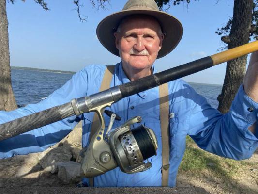 Charles Glasscock has been catching catfish at Wind Point Park for more than 50 years, using ‘Big Yellow,’ the long distance casting rod he built back in 1959. Photo by Luke Clayton