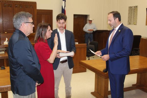 Newly elected Texas House District 2 State Representative Jill Dutton of Van takes the oath of office administered by United States District 5 Congressman Lance Gooden of Terrell Feb. 14 during a swearing-in ceremony in the Van Zandt County District Courtroom in Canton. Standing with Dutton were her husband, David, and her son, D. J. Photo by David Barber