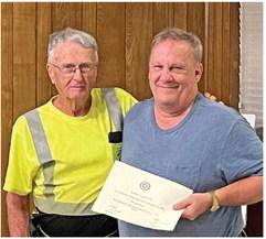 VZC Pct. 4 Patrol Coordinator Bobby Harvey presented member Eric Muller a certificate for completing patrol training. Photo by Tim Ball