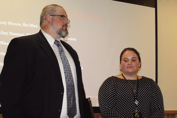 At the conclusion of the Leadership Van Zandt County Class 5 Graduation Ceremony, Outgoing Leadership VZC Chairman Jonathon Manning presented Jessica Henshaw of Prosperity Bank as his successor to serve as Leadership VZC Committee Chairperson. Photo by David Barber