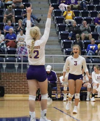 Sophomores Gracie Cates (12) and Brilee Ditto (3) celebrate after an Edgewood point during the team’s run at the Hardman-Watson Tournament in Wills Point. Photo by David Kapitan