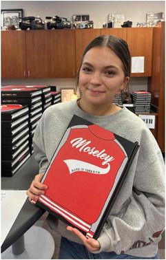 Van High School senior and Vandalite yearbook editor Cora Moseley proudly displays a copy of the 2022-23 Vandalite yearbook. The theme of the yearbook is ‘Make It Your Own.’ Photo courtesy of the Van High School Journalism Department