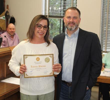 Karen Burns was recognized for her 30 years of service to Van Zandt County March 1 during the regular meeting of the VZC Commissioners Court. VZC District Judge Chris Martin presented Burns to those in attendance at the commissioners’ court meeting. Photo by David Barber