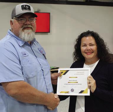 City of Van Public Works Director Kevin Johnson was presented a ‘Certificate of Appreciation’ for his 20 years of service as a city employee. Presenting the certificate was Van Mayor Tammy Huff. Photo by David Barber