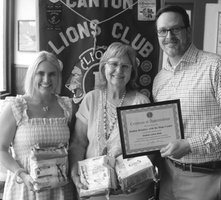Following her presentation during the May 14 weekly Canton Lions Club Luncheon, Hope Center Executive Director Debbie Brinkley, middle, was presented with a ‘Certificate of Appreciation’ by Canton Lions Club President Jonathan Helvey and Canton Lions Club Member Lace Deibert. Photo by David Barber