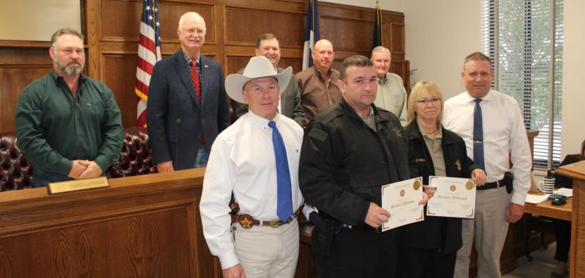 Two employees of the VZC Sheriff’s Department were recognized by VZC Sheriff Steve Hendrix and the VZC Commissioners Court for their years of service to VZC Dec. 8. Recognized were, front row, dark jackets, Deputy Sam Henson (15 years) and Lieutenant Melonie Williams (12 and one-half years). Photo by David Barber