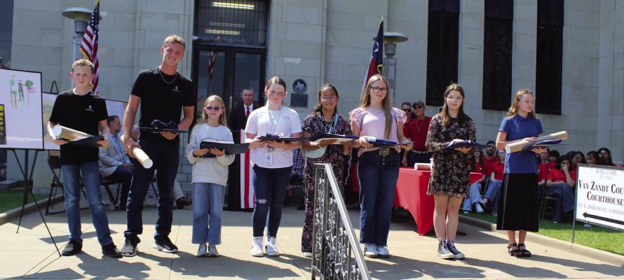 Winners of the student Art Contest and Essay Contest sponsored by the Republican Club of Van Zandt County were recognized Sept. 17 during the Constitution Day Observance program held on the northside steps of the VZC Courthouse. The winners were left to right, Gideon Irving, Gabriel Irving, Olivia Thomas, Casey Kennedy, Izabella Torres, Mercy Rain Jenkins, Madisyn Hensiek, and Kylee Branton Photo by David Barber