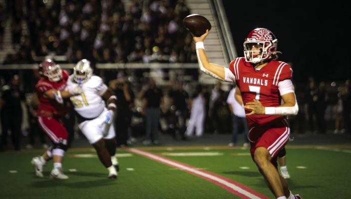 Van Vandal quarterback Rawly Hinch fires a pass downfield Nov. 7 against Texarkana Pleasant Grove. Photos by Liz Hinch