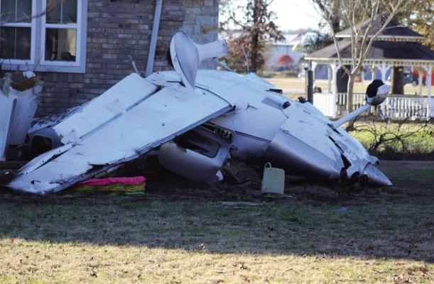 A civilian aircraft crashed in the area of Private Road 7005 in Edgewood on Dec. 26, 2003, at around 6 p.m. The plane came to rest, striking a residence at the location and causing minor damage to the home. Photo by Nick Gibbons, The County Eagle