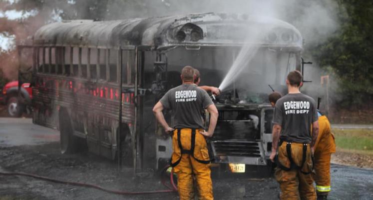 SCHOOL BUS CATCHES FIRE