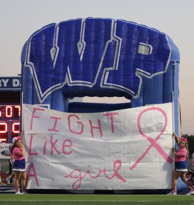 Wills Point commemorated Breast Cancer Awareness Month with a run-through that read: “Fight Like A Girl.” Photo by David Kapitan