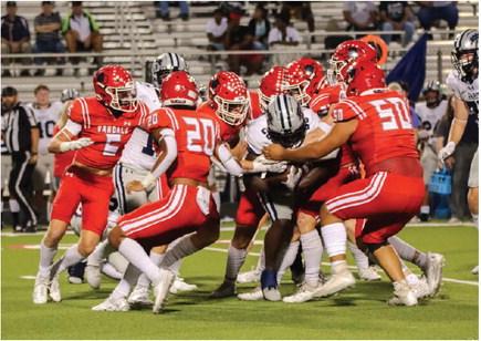 A host of Van Vandal defenders surround a Paris Wildcat running back to bring him down for a minimal gain Sept. 15. Van moved to 3-1 overall with a 28-27 victory. Among those making the tackle were defensive back Cade Christensen (5), Colton Miller (20) and Armando Lozano (50). Van opened district play at Brownsboro Sept. 22 and will return home to face their Van Zandt County rival, the Canton Eagles, Sept. 29. Courtesy of the Van High School Journalism Department
