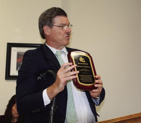 East Texas Council of Governments (ETCOG) Executive Director David Cleveland was in attendance at the regular meeting of the Van Zandt County Commissioners Court June 18 to show a plaque recognizing the late VZC Pct. 2 Commissioner Virgil Melton Jr.’s service on the ETCOG board of directors. Cleveland was scheduled to present the plaque to the family at the funeral service for Melton which was held later that day. Photo by David Barber