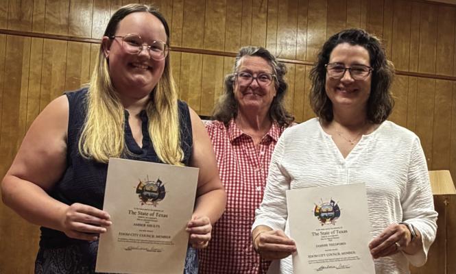 Amber Shults (far left) and Jammie Thedford (far right) were sworn in as members of the Edom City Council July 9 during the regular monthly meeting of the council. Standing with the sworn-in council members was Edom Mayor Barbara Crow. Courtesy photo