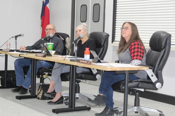 Van City Council members Mark Heatwole and Melissa Rust, and City of Van Secretary Sereca Huggins (left to right) listen to a speaker during the ‘open forum’ portion of the regular monthly meeting of the council Nov. 15. Photo by David Barber