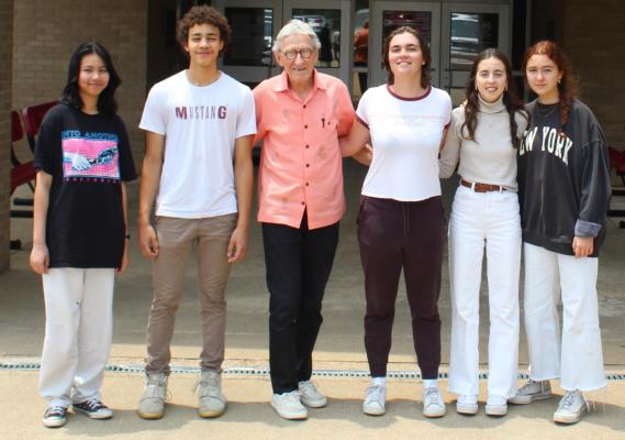 Five foreign exchange students are about to end their 2021-’22 school year at Van High School. Standing with VHS Counselor Bill Giles, third from left, are left to right, Siraprapha Samanwong (Thailand), Elize Esangbedo (Germany), Leia Boudeau (France), Eva Gonzalez Roade (Spain), and Marta Lopez-Guanch (Spain). Photo by David Barber