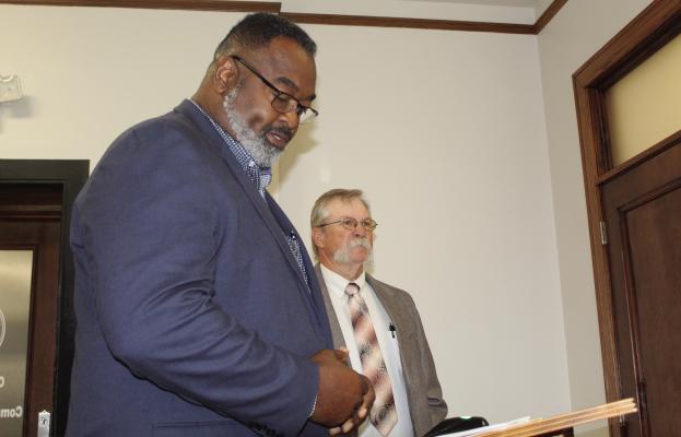 Texas A&M AgriLife Extension Service District Extension Administrator Hurley Miller (foreground) introduced new Van Zandt County Extension Agent Leon Watson Oct. 9 during the regular meeting of the VZC Commissioners Court. Photo by David Barber