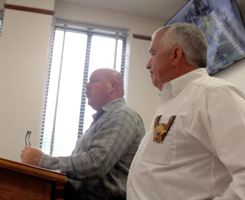 Lt. Joe Maddox of the Van Zandt County Sheriff’s Department (left) and VZC Sheriff Joe Carter discussed the need for a communications and technology administrator in the sheriff’s department during the regular meeting of the VZC Commissioners Court. The commissioners’ court approved Maddox to serve as the new communications and technology administrator in a unanimous vote. Photo by David Barber