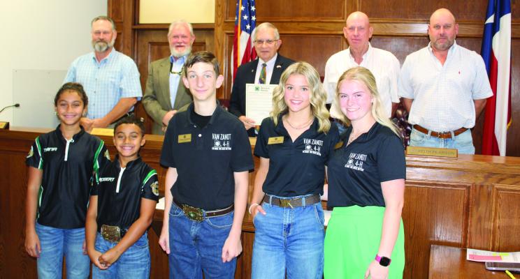 In recognition of National 4-H Week during the week of October 6-12, the Van Zandt County Commissioners Court unanimously approved a resolution Sept. 25 during the regular meeting of the commissioners’ court. Standing with VZC Judge Andy Reese and members of the commissioners’ court were several members of the VZC 4-H organization. Photo by David Barber