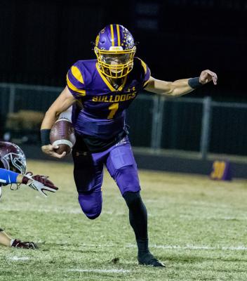 Hayden Wilcoxson and the Edgewood Bulldogs notched the only win for any county football team Oct. 14. Wilcoxson was a key factor in the contest, scoring on a 12-yard run in the first quarter before completing a 26-yard touchdown pass to Alexander Watson in the second. Photo by Dusty Goodwin