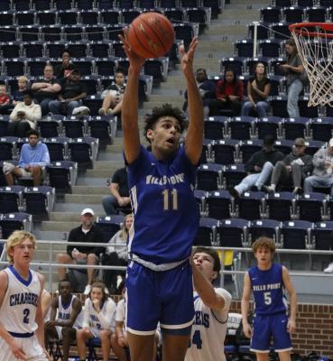Kody Alexander and the Wills Point Tigers improved to 2-0 in district play with a 16-point road win over the Nevada Community Braves Jan. 3. Photo by David Kapitan